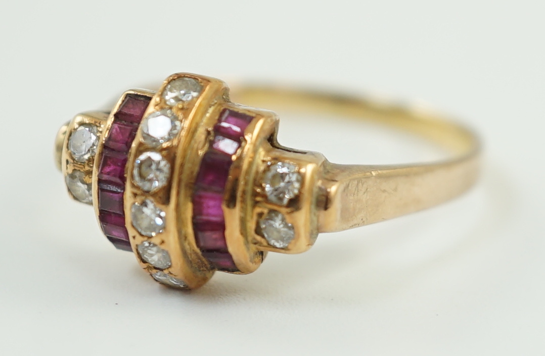 A 1950's gold and graduated five row ruby and diamond set demi lune dress ring
